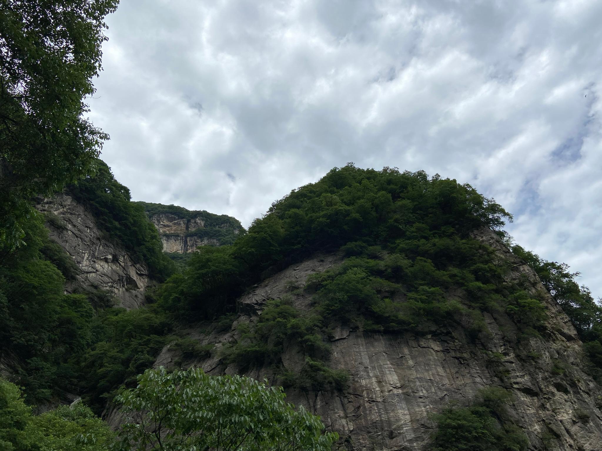 Looking up at the mountains and sky